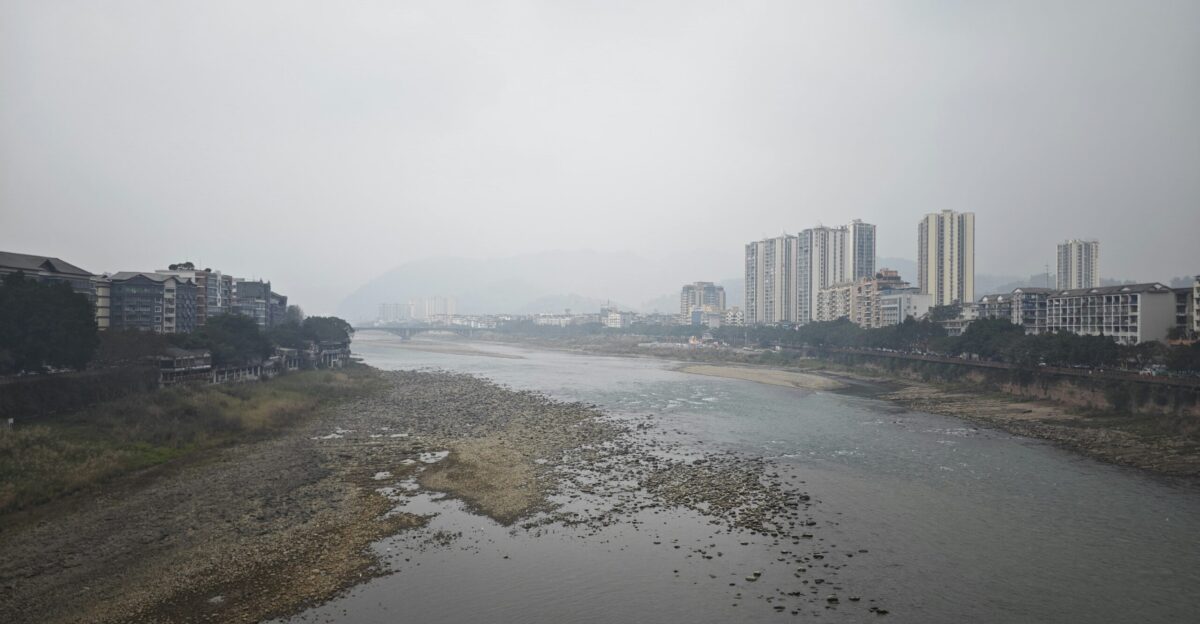 a body of water surrounded by tall buildings