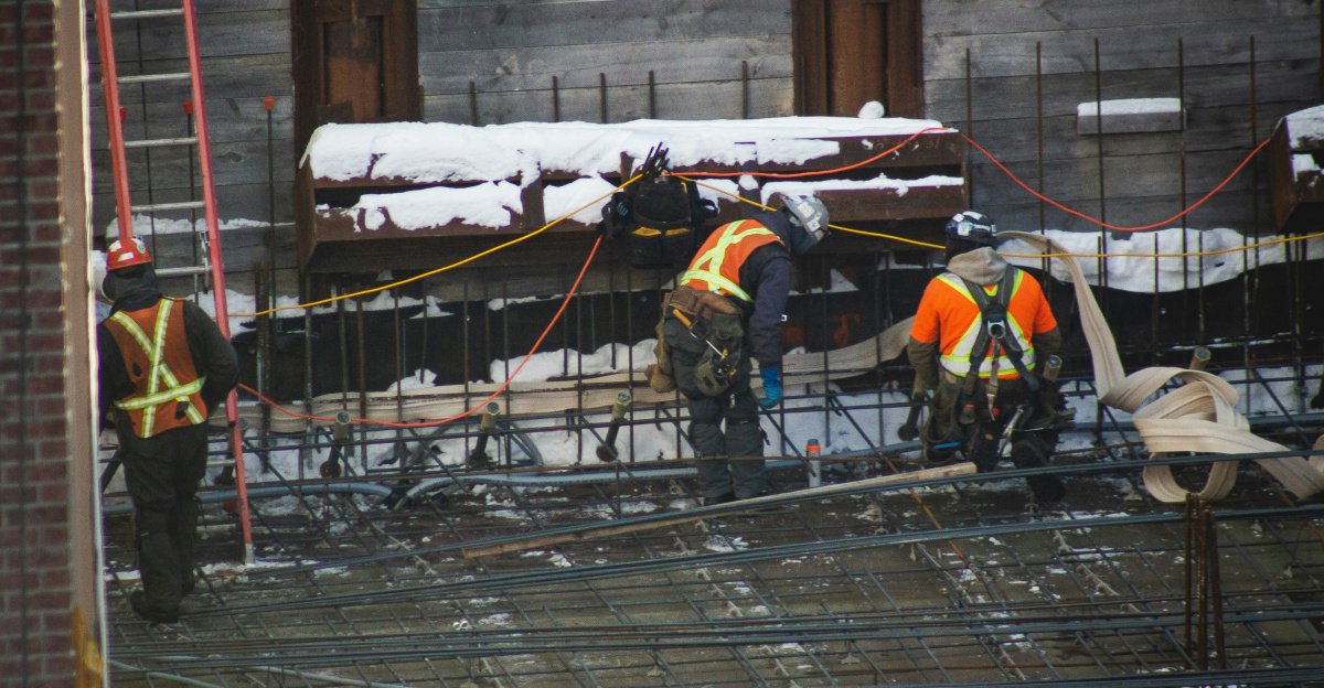 a group of construction workers working on a building