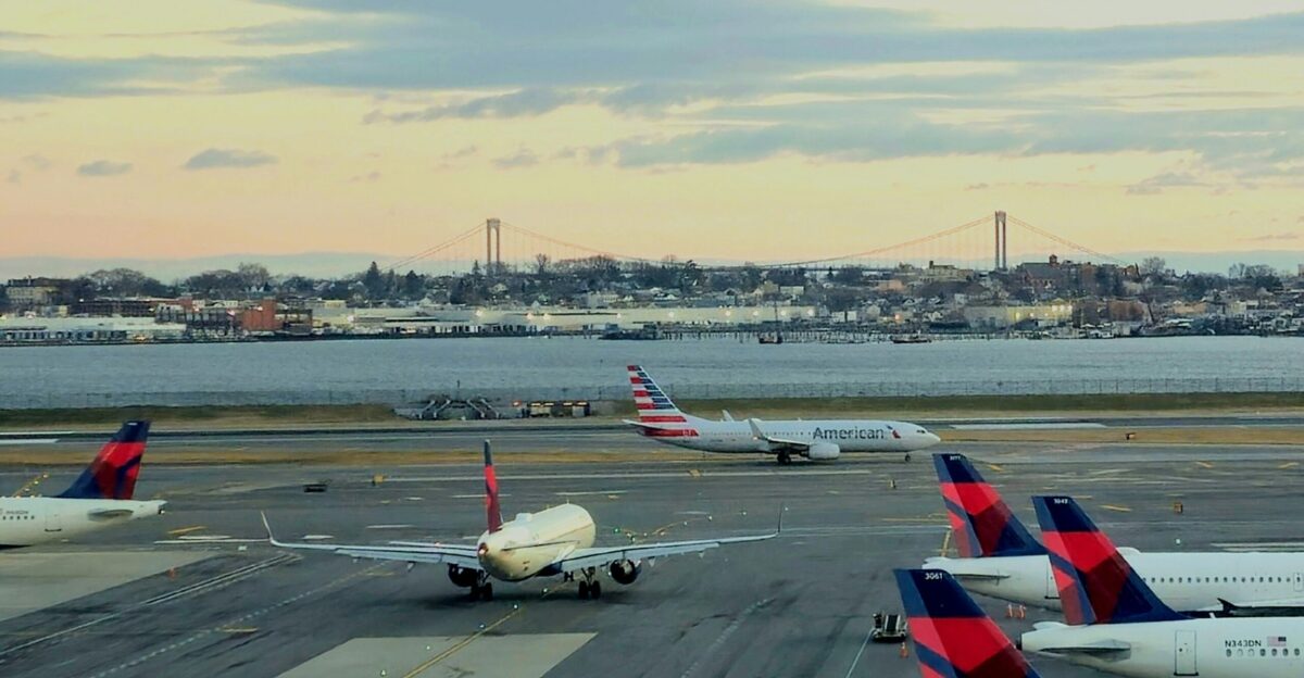 a bunch of airplanes that are on a runway