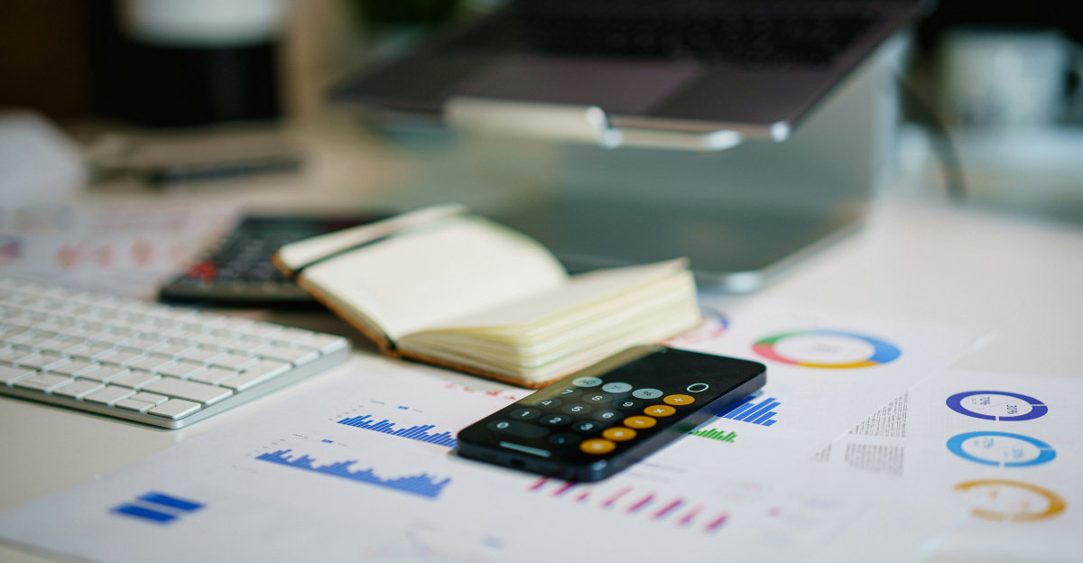 a remote control sitting on top of a table next to a book