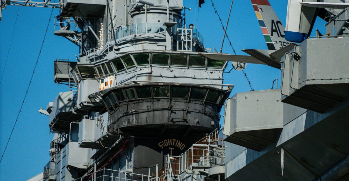 a large airplane sitting on top of an aircraft carrier