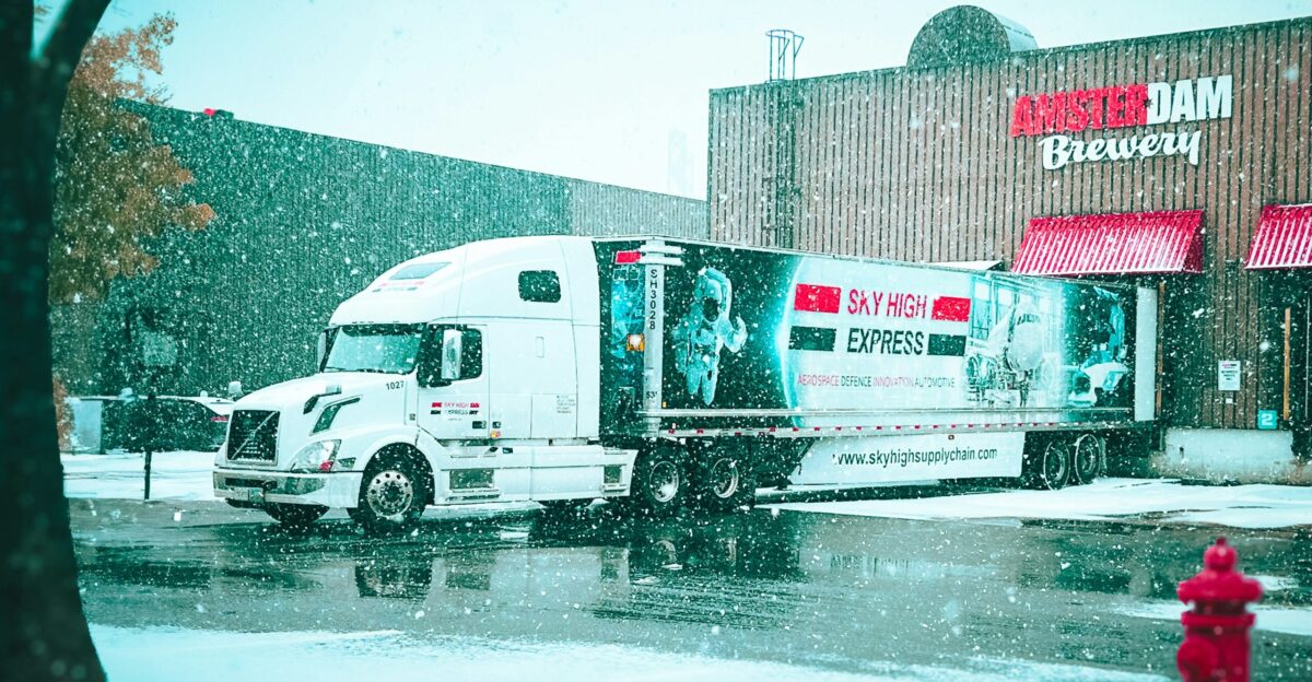 a delivery truck parked in front of a store