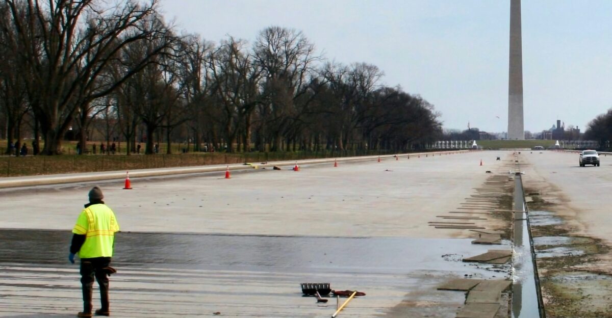 a man standing in the middle of a road