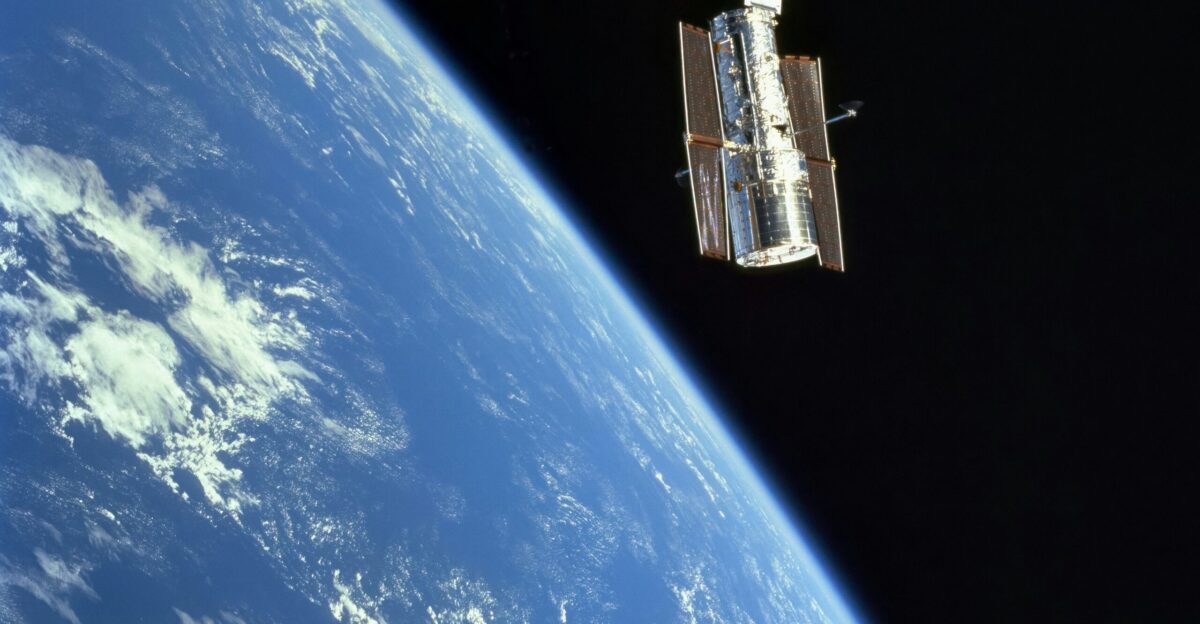 the space shuttle is flying over the earth