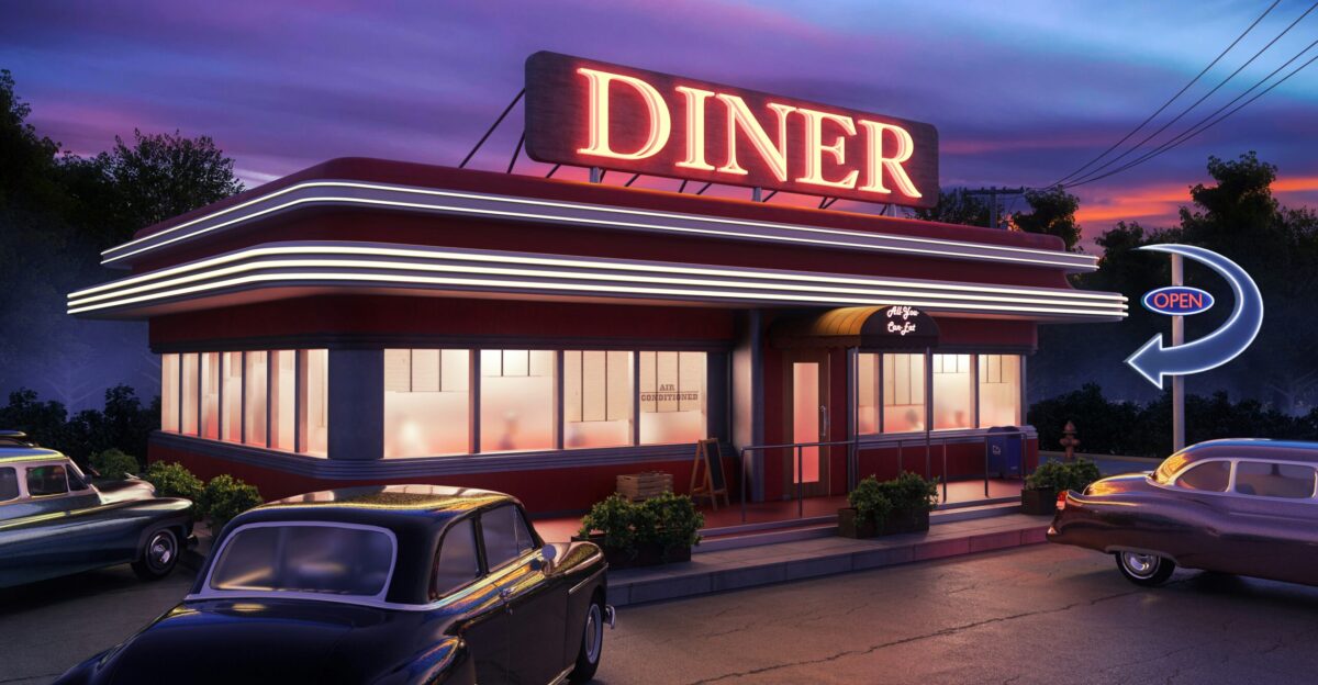 a diner with cars parked in front of it