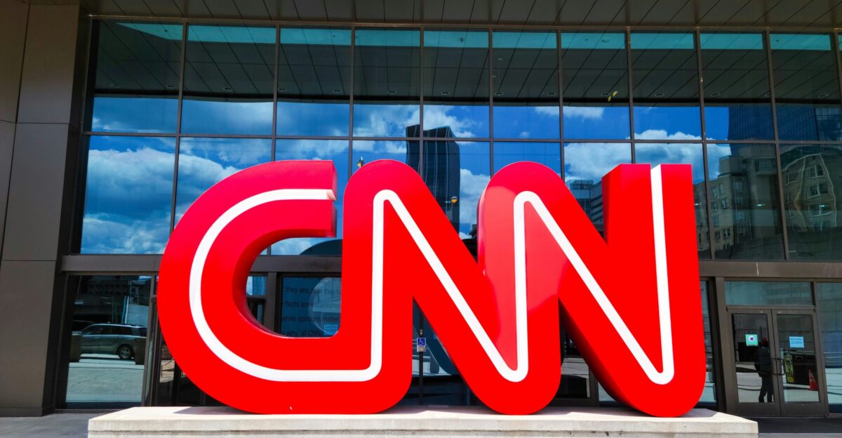 the cnn logo is displayed in front of a building