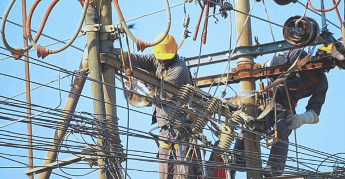 a man working on an electrical pole