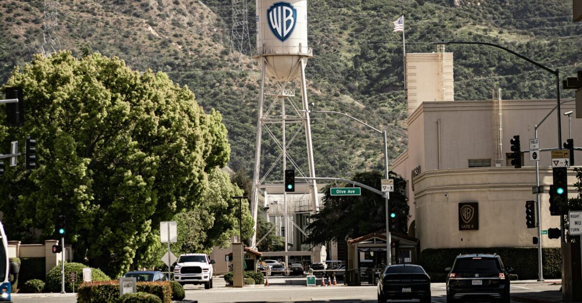 a city street with a water tower in the background