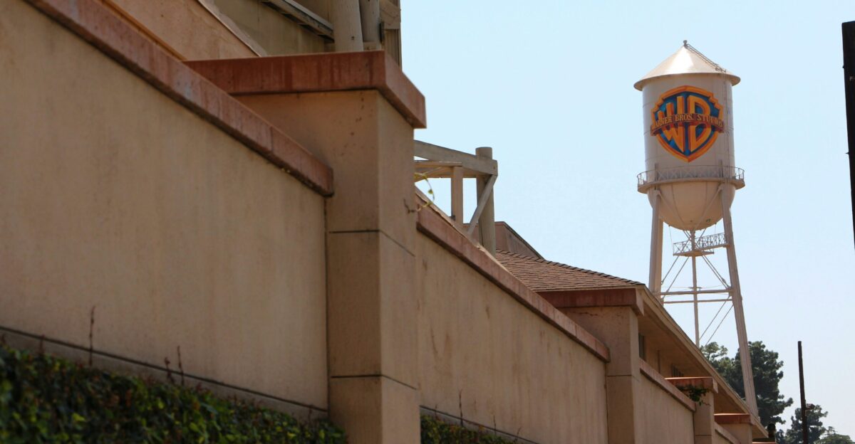 a tall water tower sitting next to a building