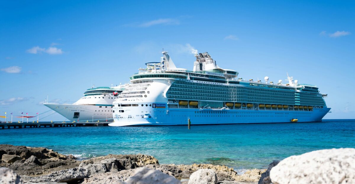 a cruise ship docked at a dock in the ocean