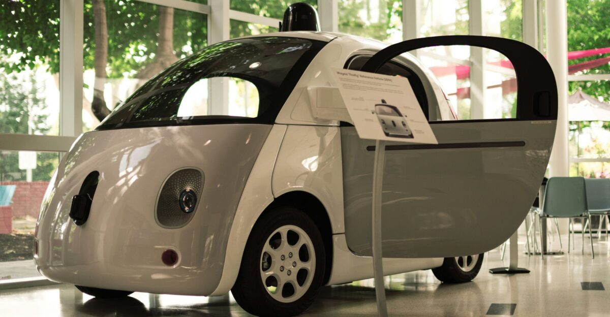 a small white car parked in a room