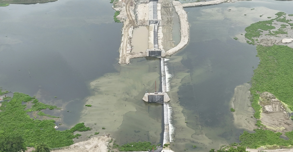 an aerial view of a bridge over a body of water