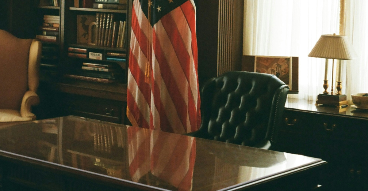 A desk with an american flag on top of it