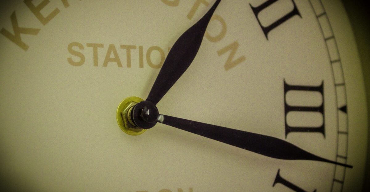 A close up of a clock face with the time on it