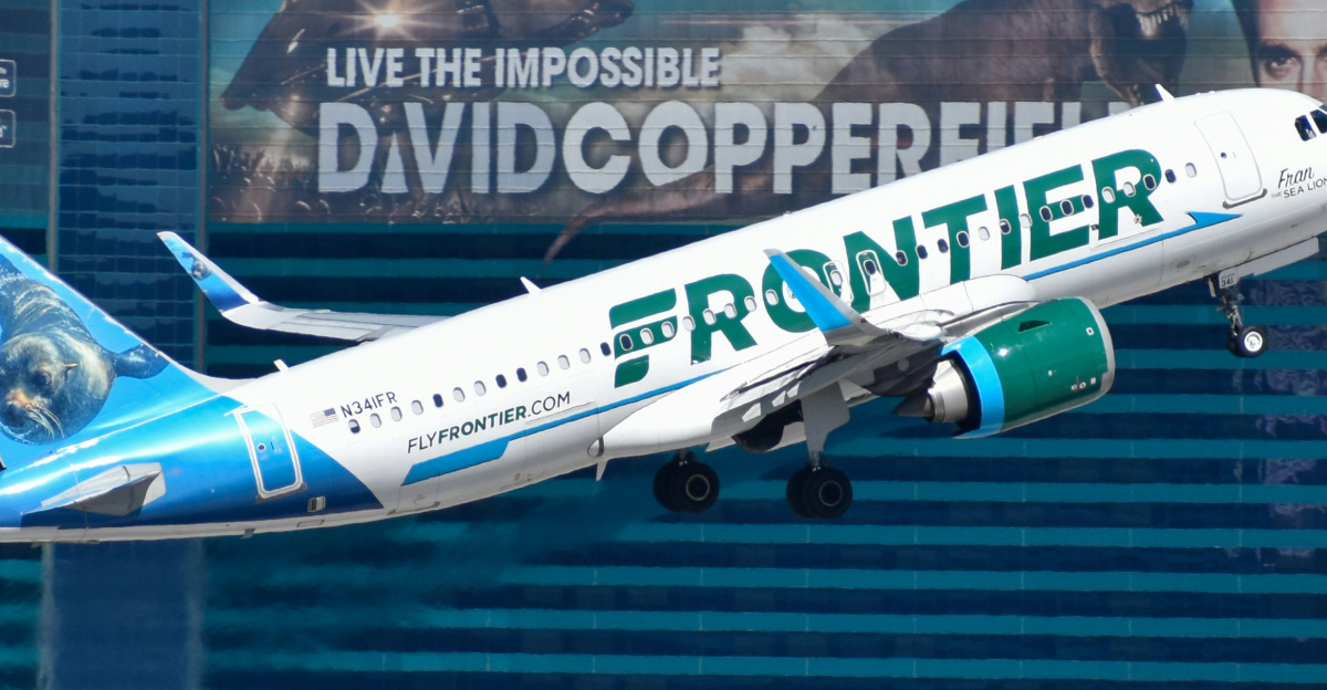 A large passenger jet flying over the las vegas strip