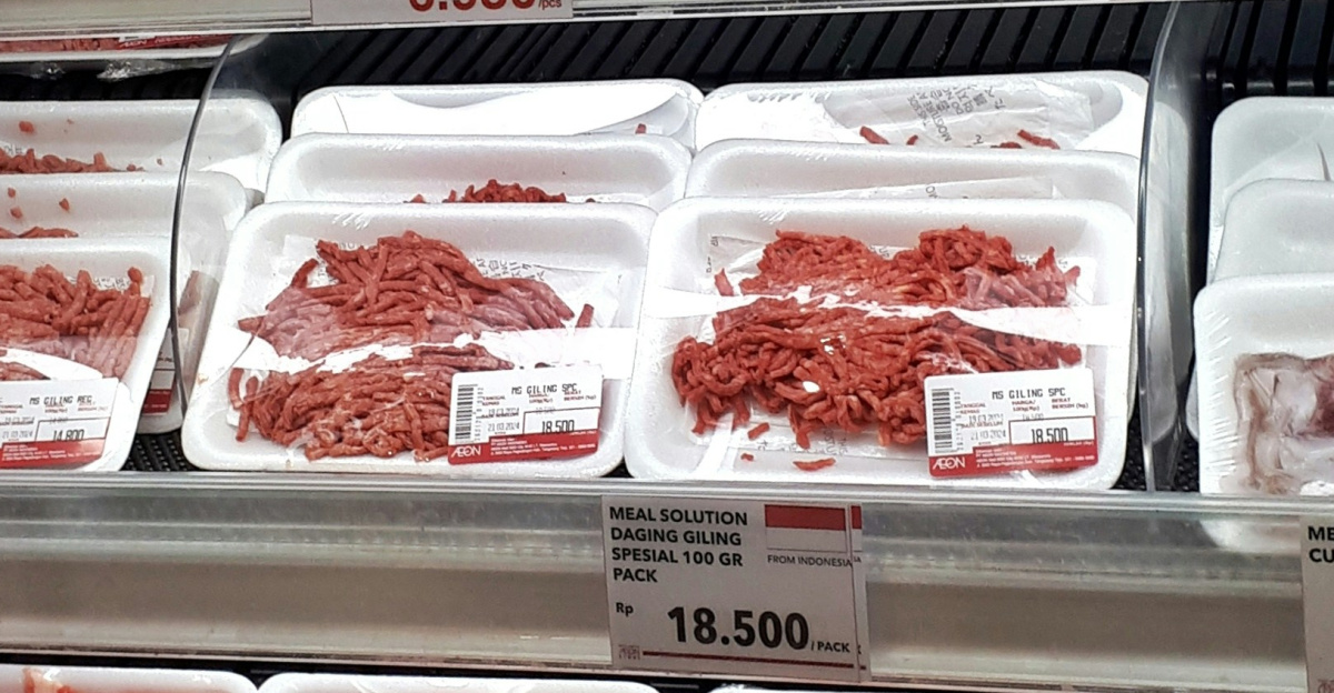 A display case filled with lots of different types of meat