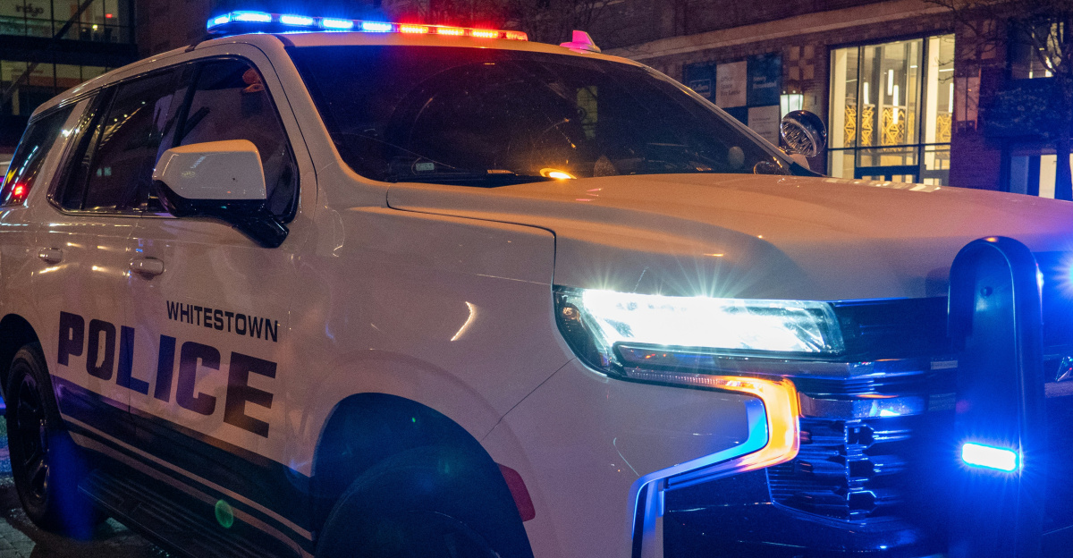 A police truck parked on the side of the road