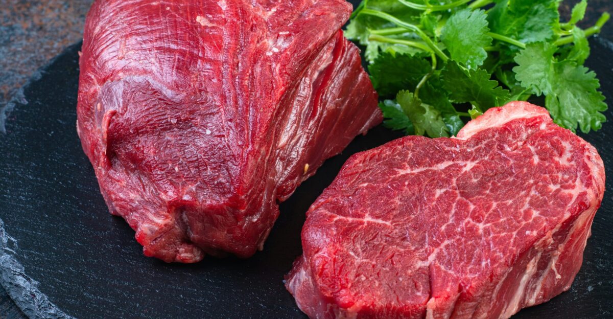 Two steaks on a plate with parsley