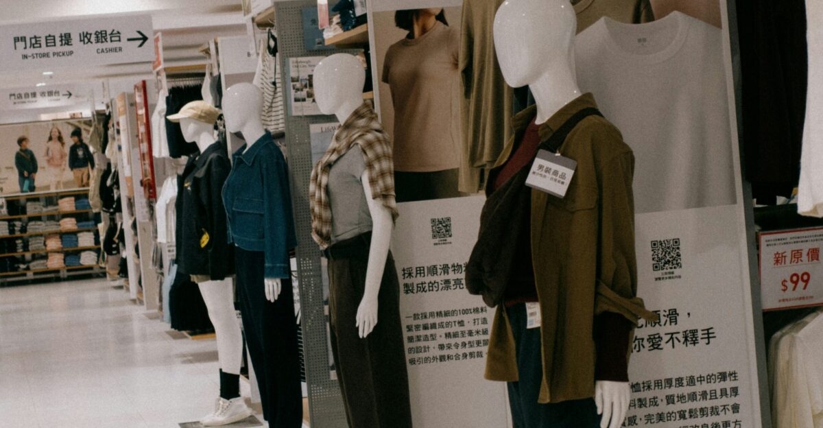 A group of mannequins are standing in a store