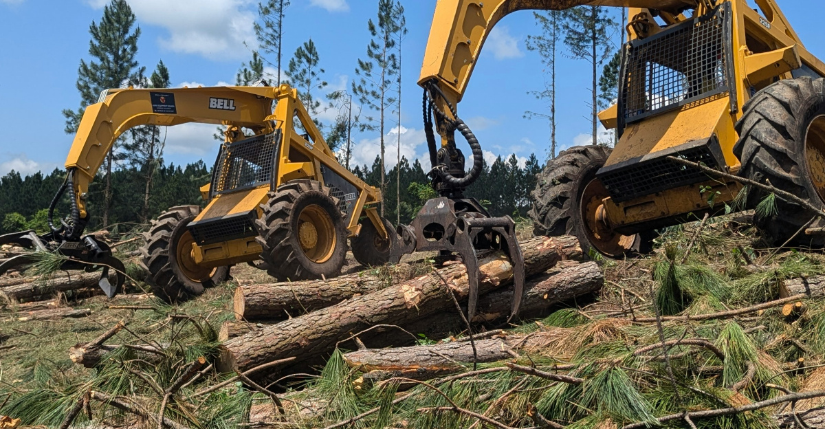 A couple of large machines that are on a hill