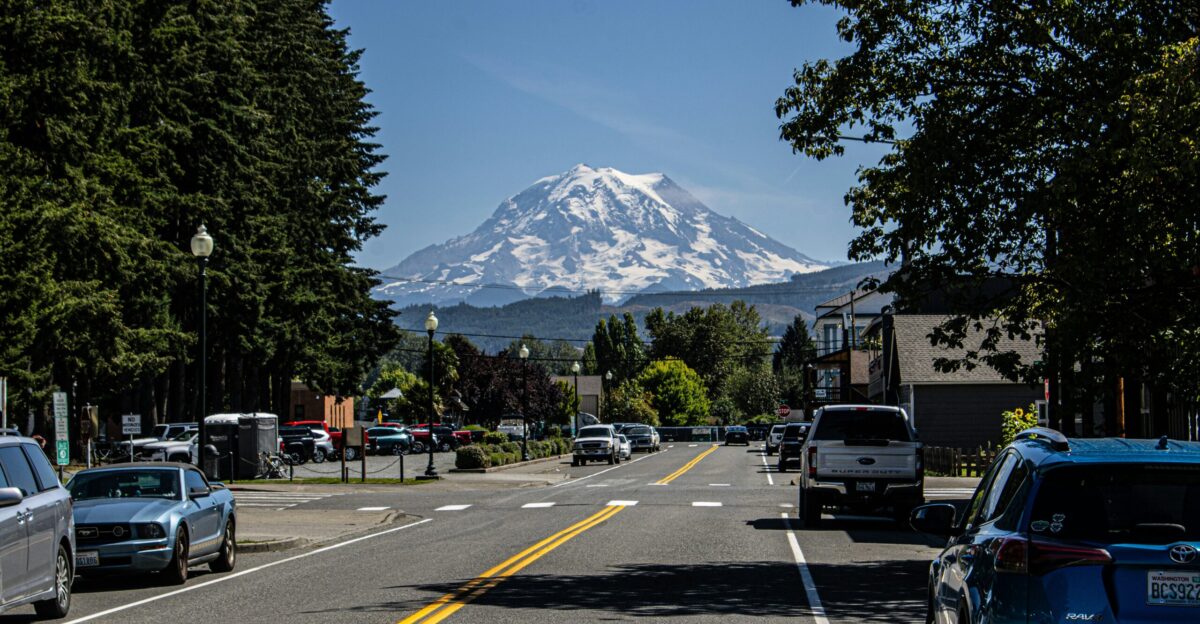 A street with a mountain in the background
