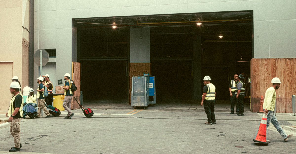 A group of people standing outside of a building