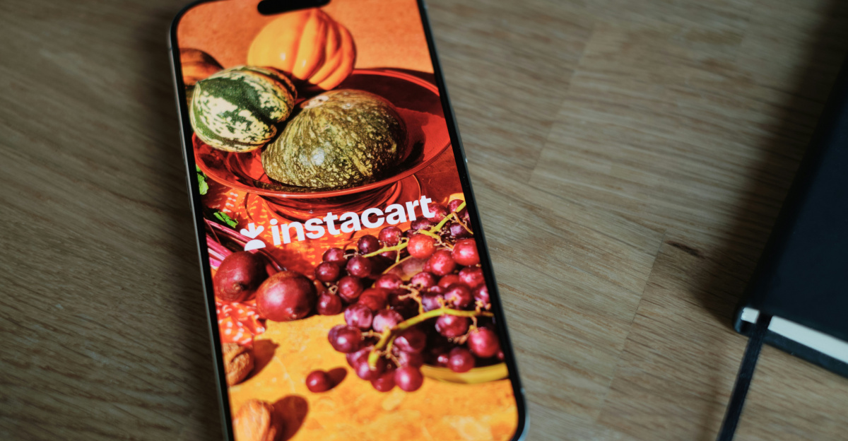 A cell phone sitting on top of a wooden table