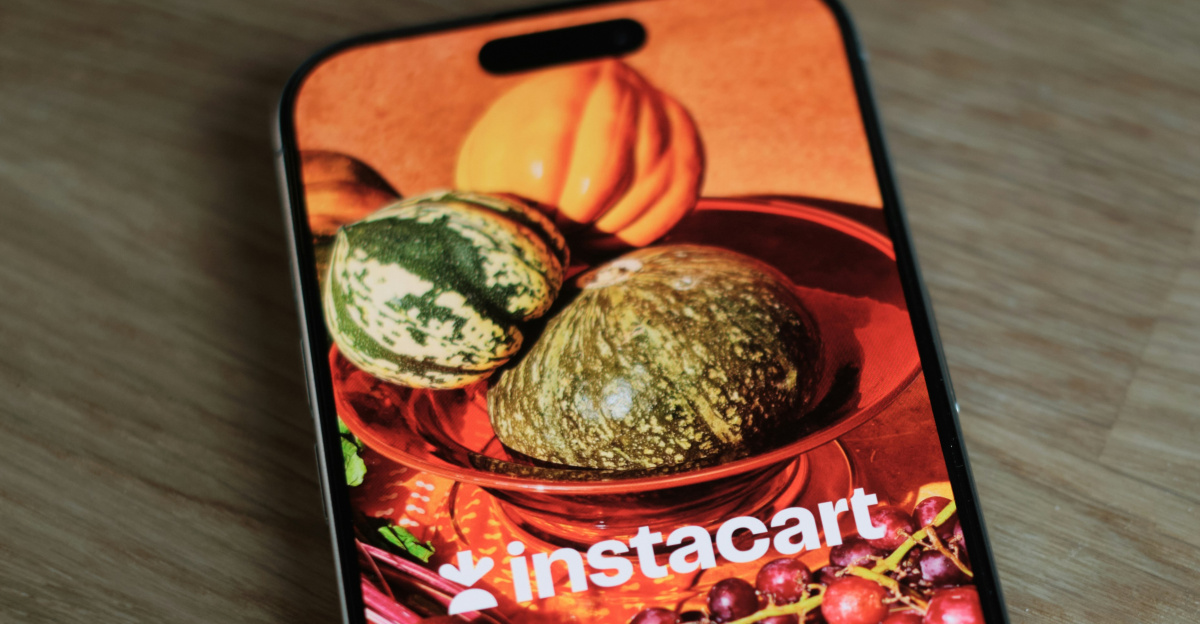 A cell phone sitting on top of a wooden table