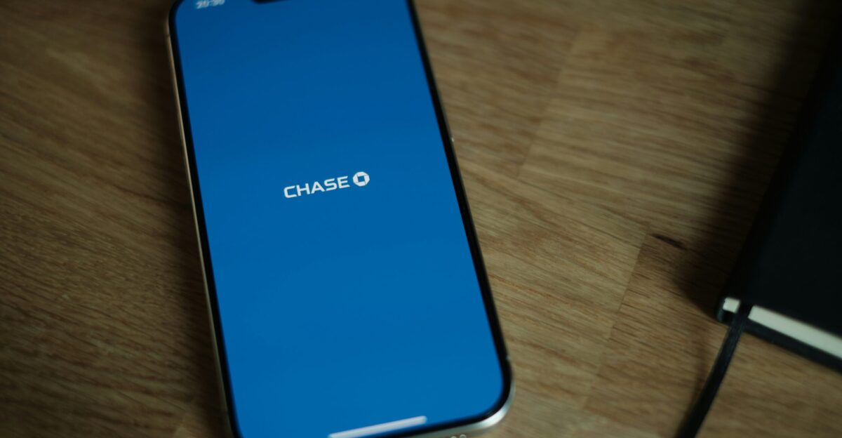 A cell phone sitting on top of a wooden table