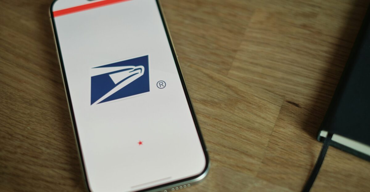 A cell phone sitting on top of a wooden table