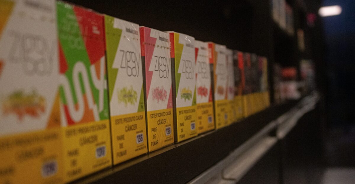 A row of sale signs on a shelf in a store