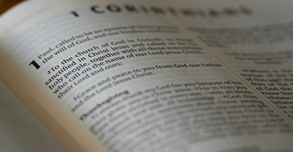 An open book sitting on top of a wooden table