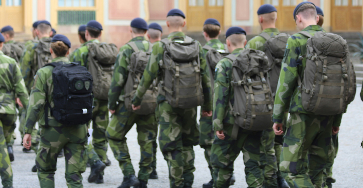 A group of military men walking down a street
