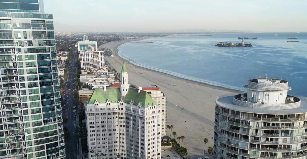 An aerial view of a city with a beach in the background