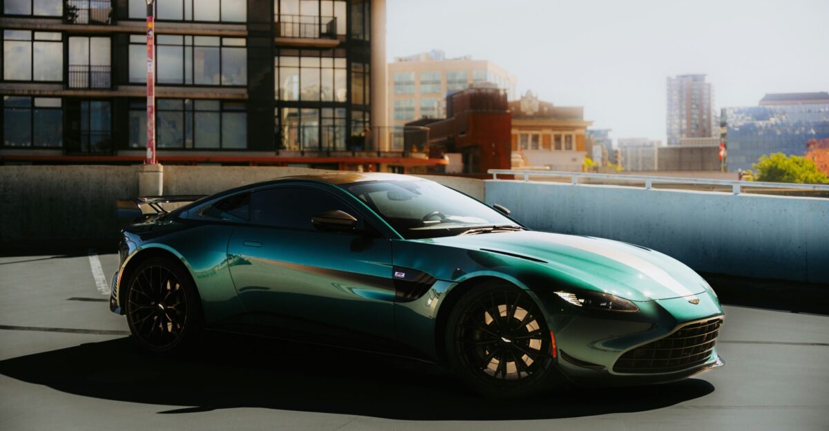 A green sports car is parked on a rooftop