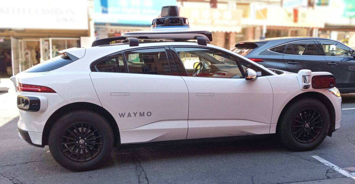 A waymo self-driving car is seen in the city