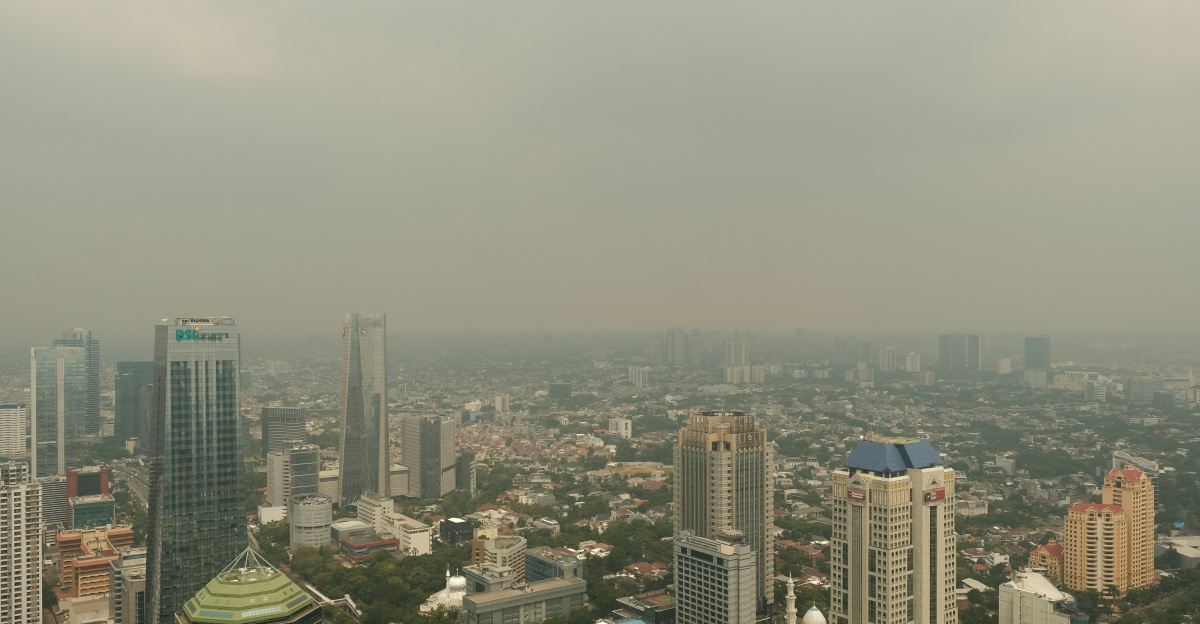 City skyline shrouded in smog.
