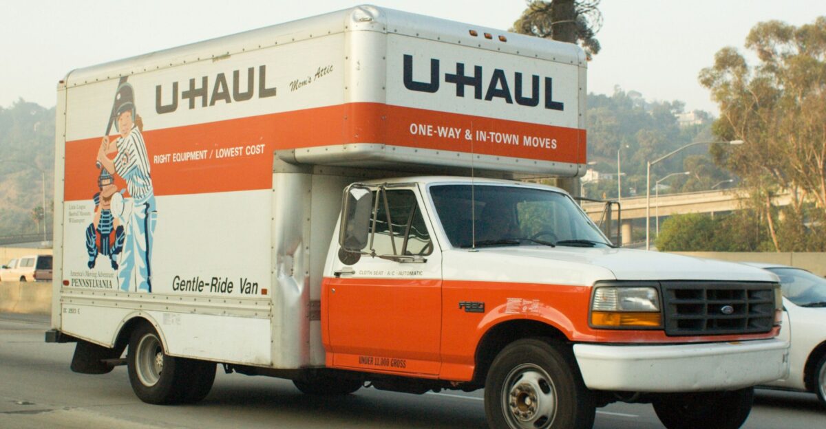 A u-haul truck driving on a highway