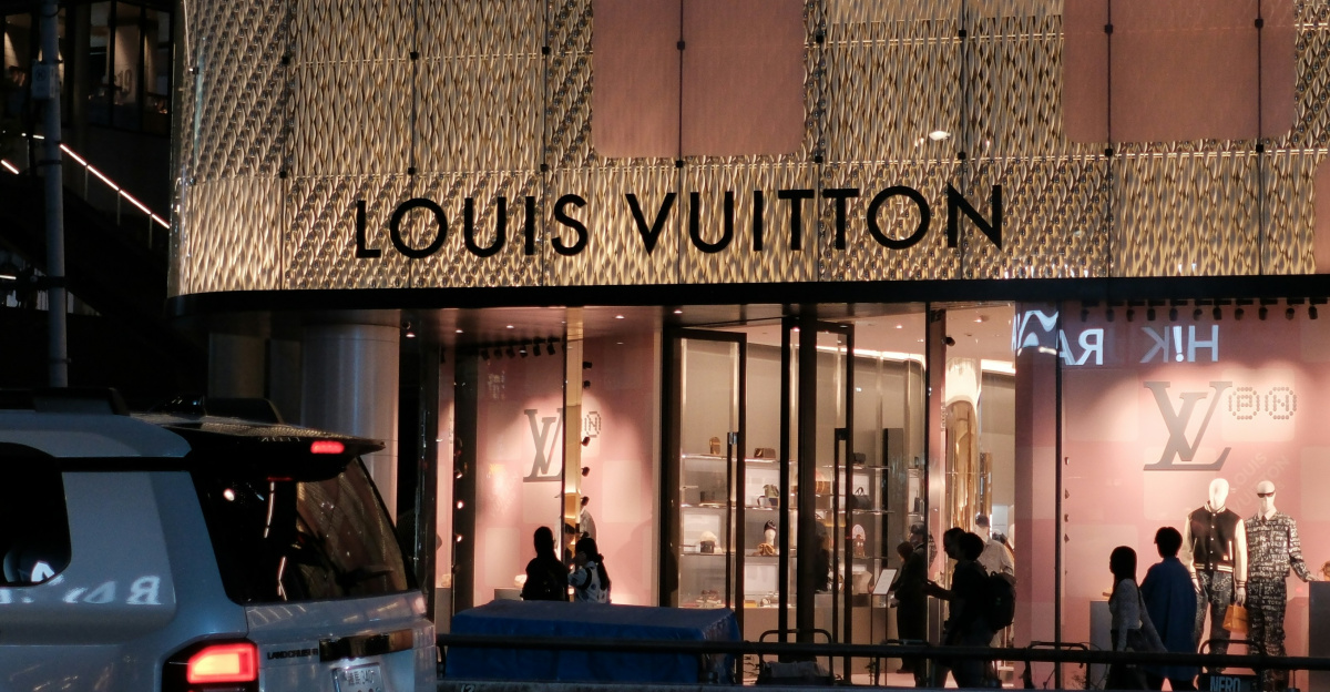 Louis vuitton store at night with cars