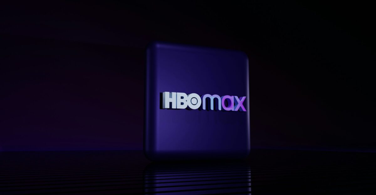 Hbo max logo on a dark reflective surface