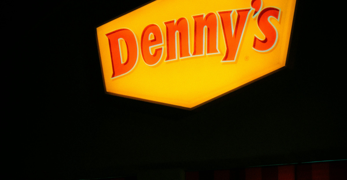 Denny s restaurant sign illuminated at night