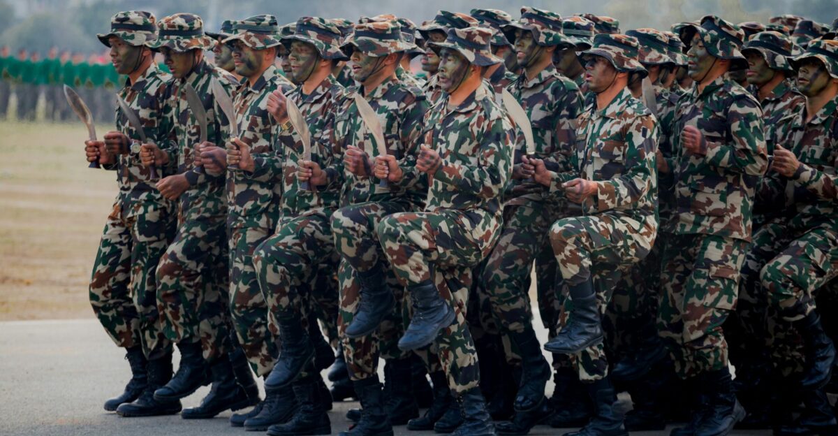 Soldiers in camouflage uniforms marching in formation
