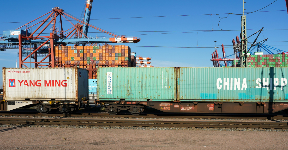 Shipping containers on a train at a port.