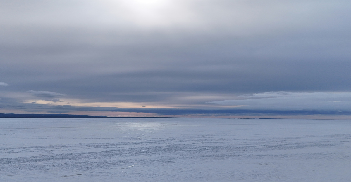 Vast frozen landscape under a cloudy sky