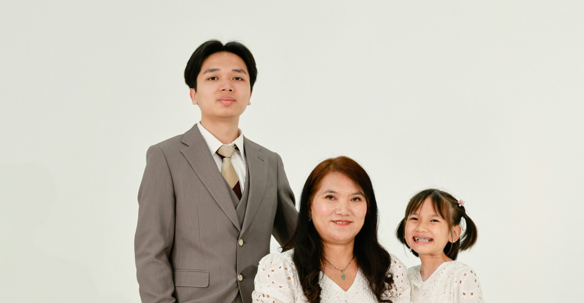 A family posing for a studio portrait