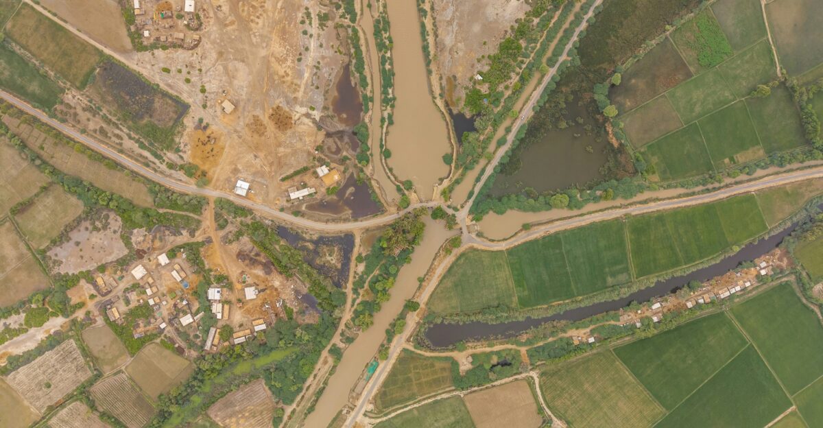 Aerial view of a rural village and agricultural fields