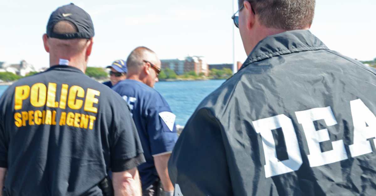 Members from the Coast Guard, Drug Enforcement Agency, Massachusetts State Police and other local and federal law-enforcement agencies offload more than 1,200 pounds of cocaine from the deck of the Coast Guard Cutter Dependable, Sept. 6, 2013. The Coast Guard seized the suspected contraband and detained two suspected smugglers during an at-sea interdiction, Sept. 2, 2013, approximately 500 miles east of Cape Cod. The drug shipment is estimated to have a wholesale value of more than $20 million. U.S. Coast Guard photo by Petty Officer 2nd Class Rob Simpson.