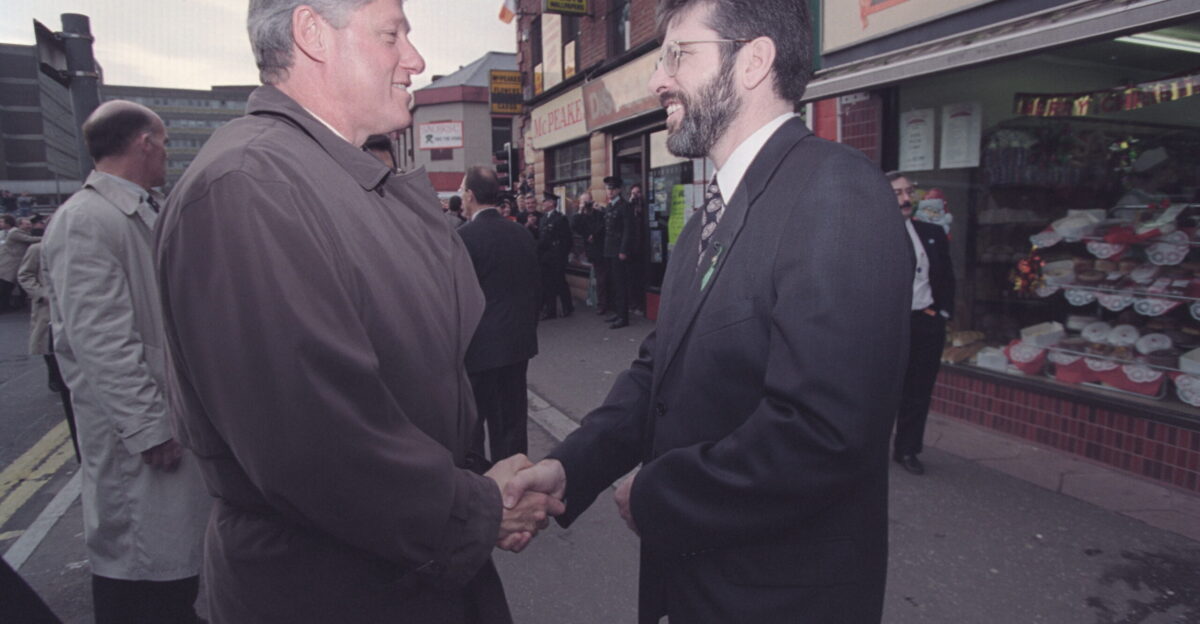 President Bill Clinton greets Gerry Adams on the Falls Road in West Belfast