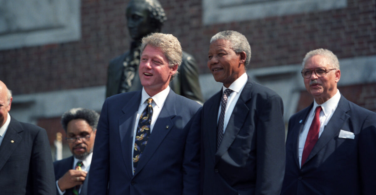 President Bill Clinton is joined on the stage with Nelson Mandela of South Africa and others at the Philadelphia Freedom Festival event