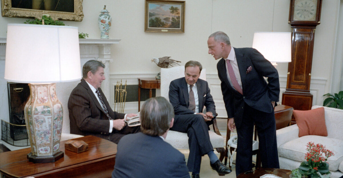 18 1983 President Reagan during a meeting with Rupert Murdoch Charles Wick not in photo Roy Cohn Thomas Bolan in the Oval Office Reagan seated at left presumably back of Bolan s head seen center left Rupert Murdoch seated center right Roy Cohn standing at right